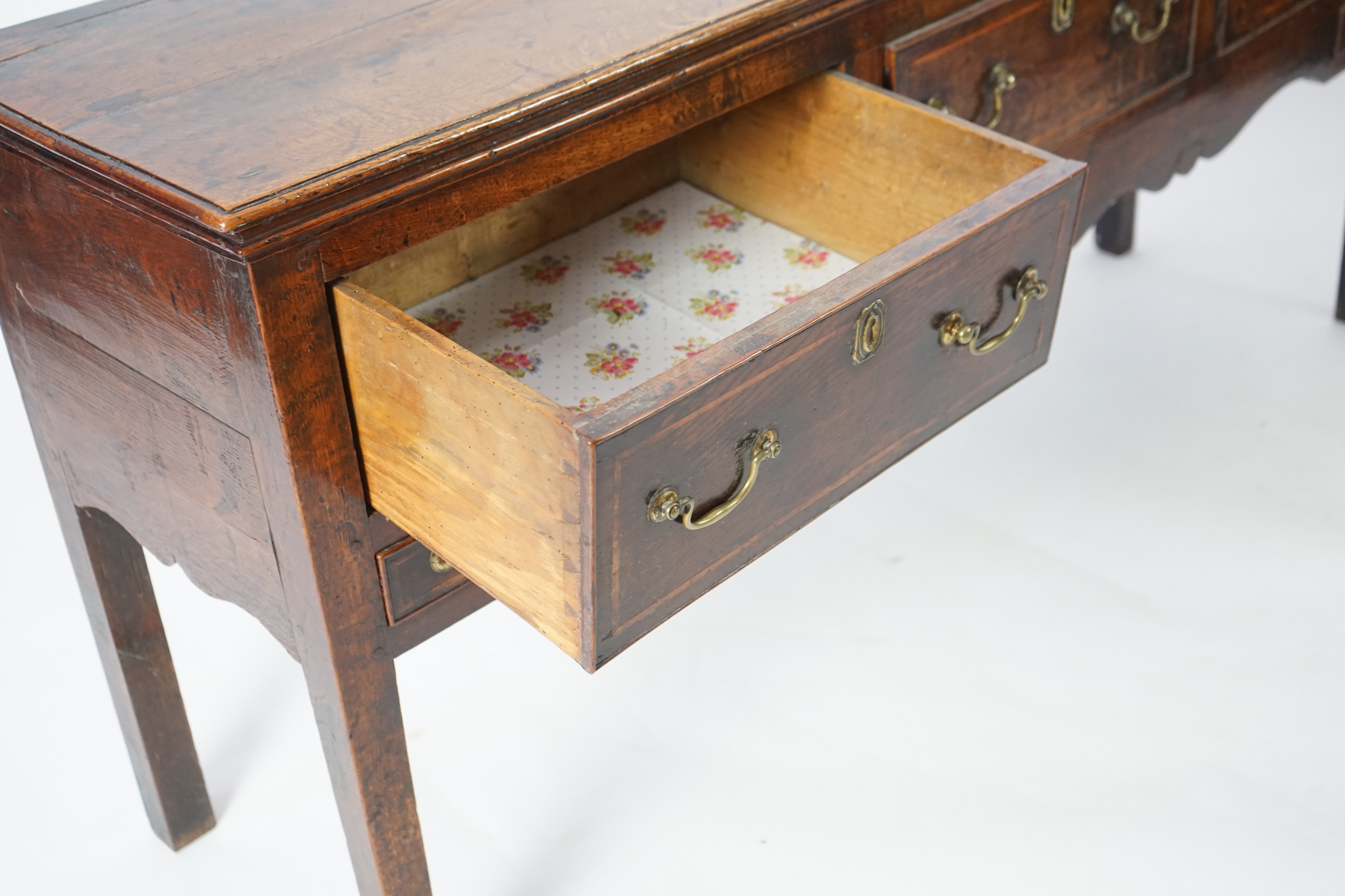 A mid 18th century oak dresser base